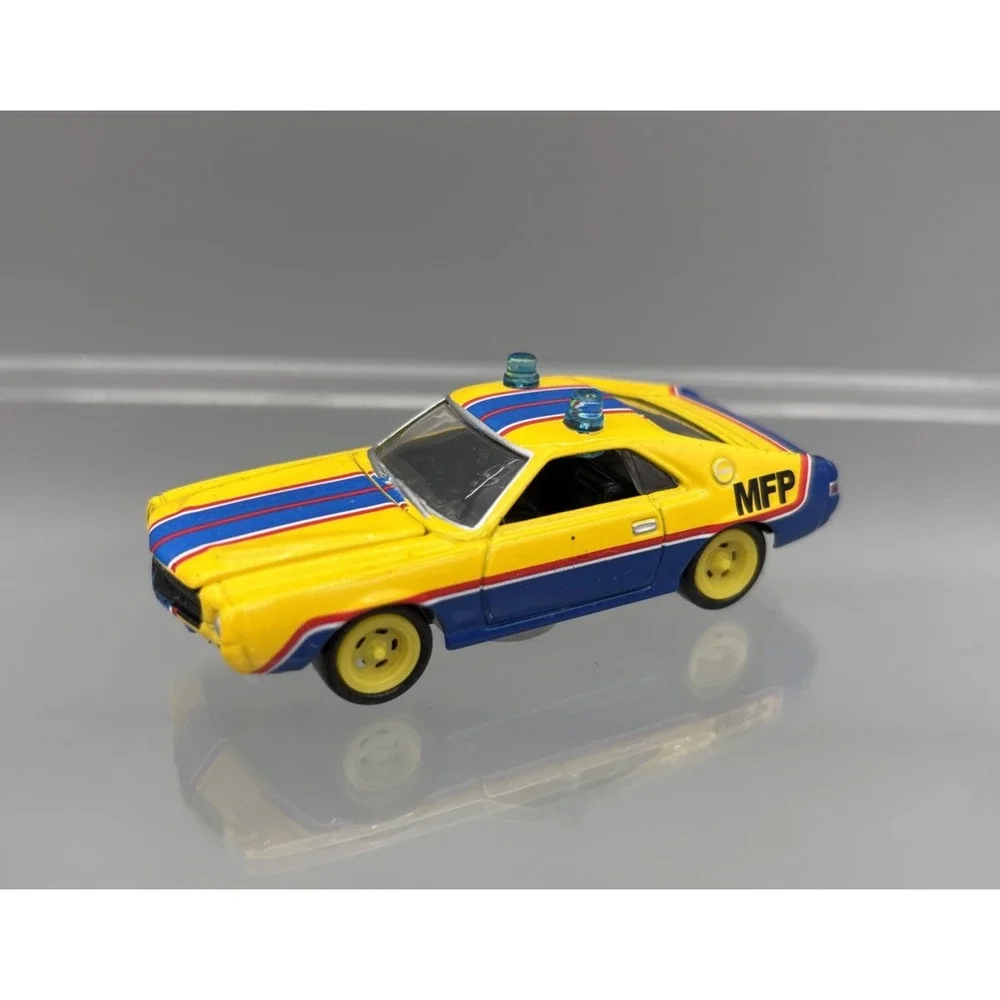 Johnny Lightning Mad Max 1968 AMC AMX MFP Main Force Patrol Car Yellow 1:64